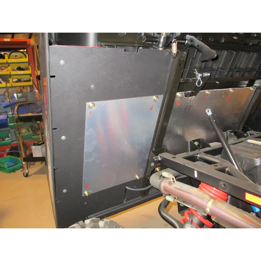 Under bed mud shield with factory heat shield