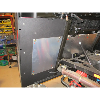 Under bed mud shield with factory heat shield